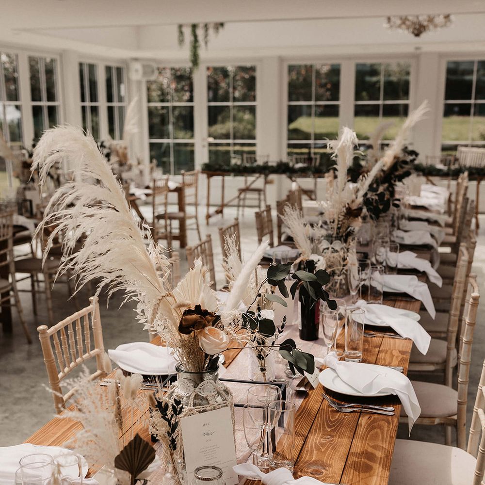 Wooden table finished with rustic vibe and dried florals