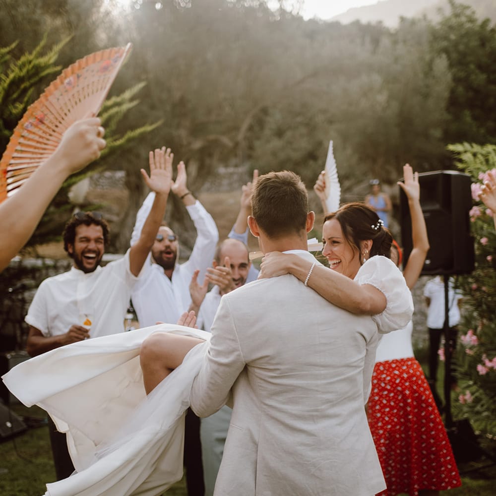 Groom lifting the bride as they dance