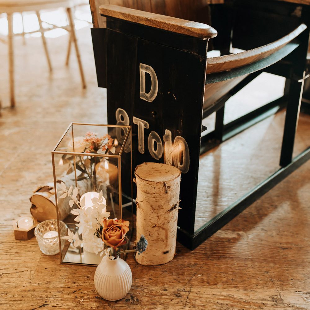 Old cinema style wedding chairs for industrial wedding ceremony with rustic aisle decor