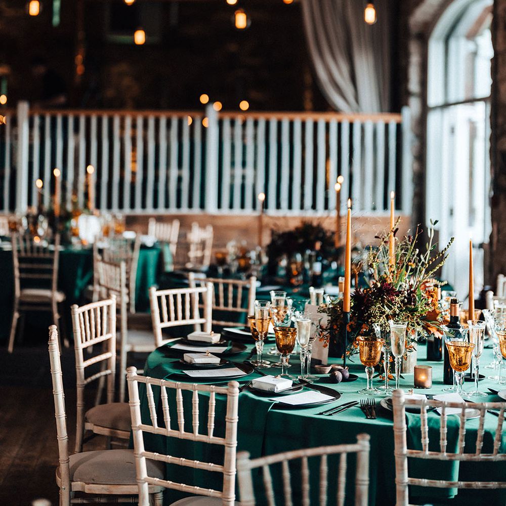 Green theme wedding and tablescape at wedding breakfast with festoon lighting 