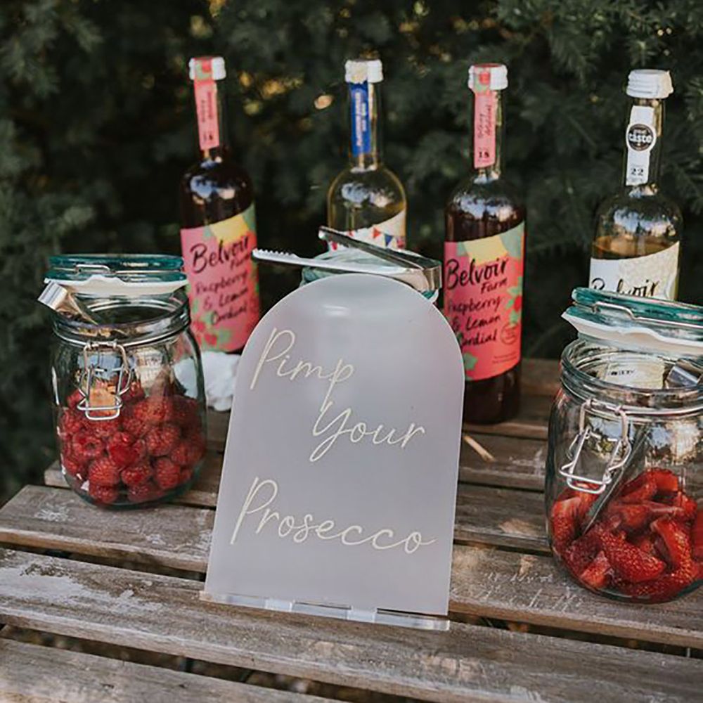 Pimp your own prosecco station at wedding featuring raspberries and strawberries Poppy Carter Portraits