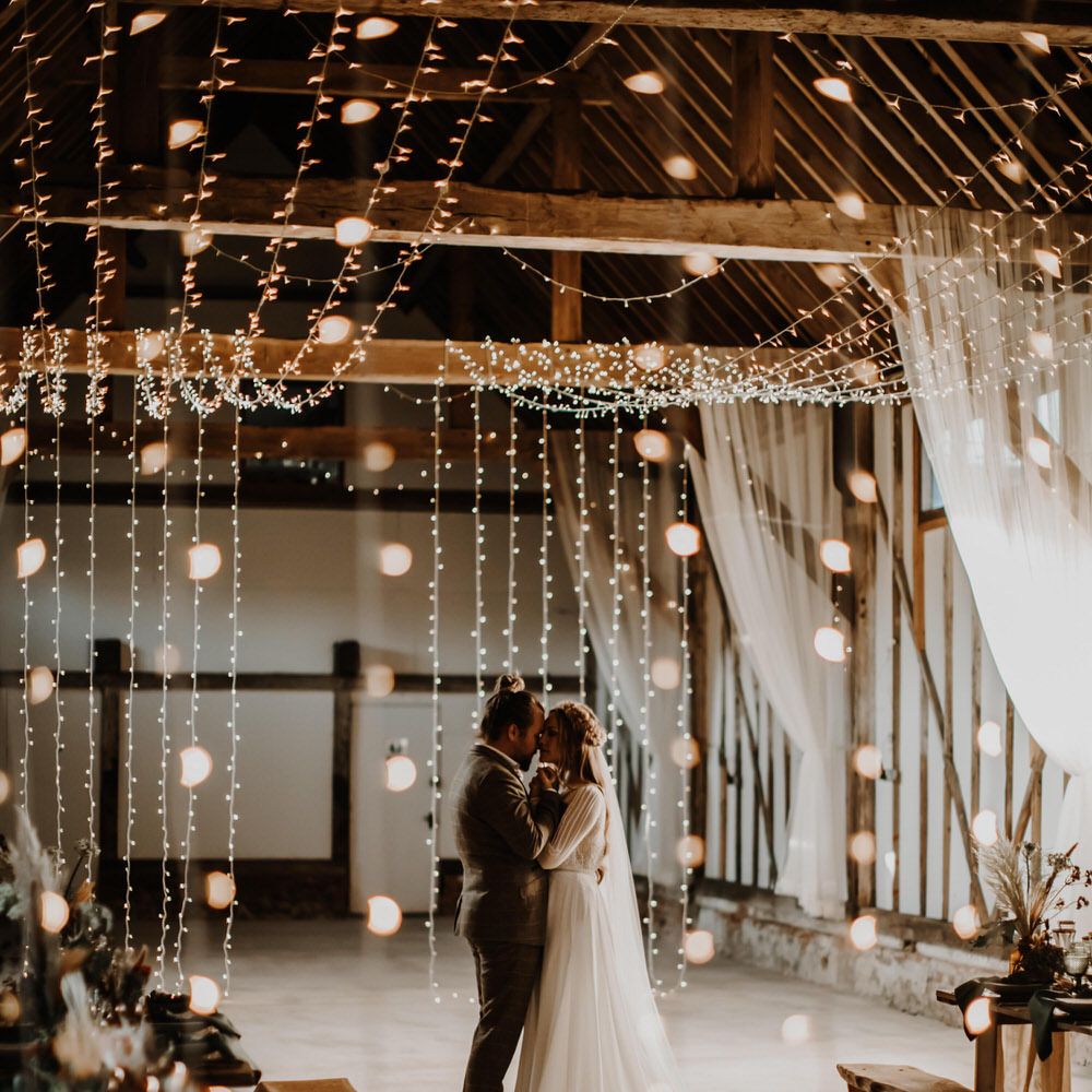 Fairy light wedding decor for romantic barn wedding