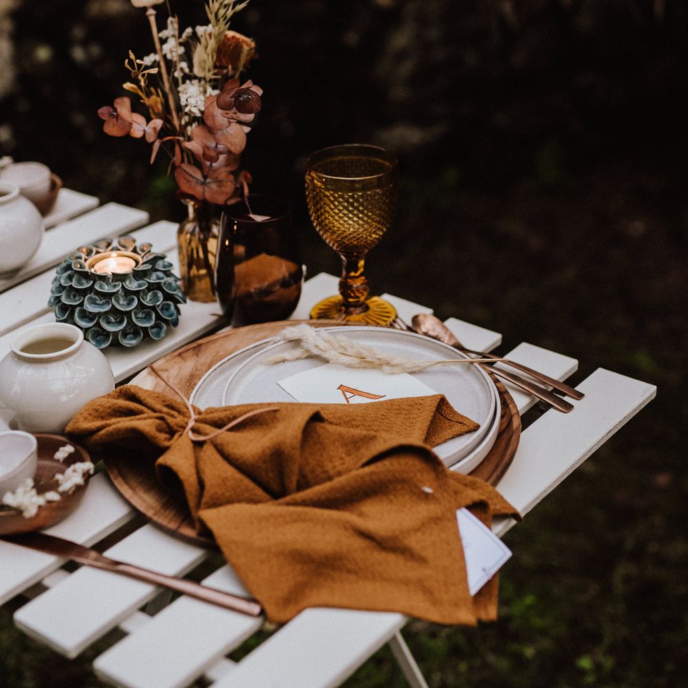 Burnt orange napkin with sprig pampas grass