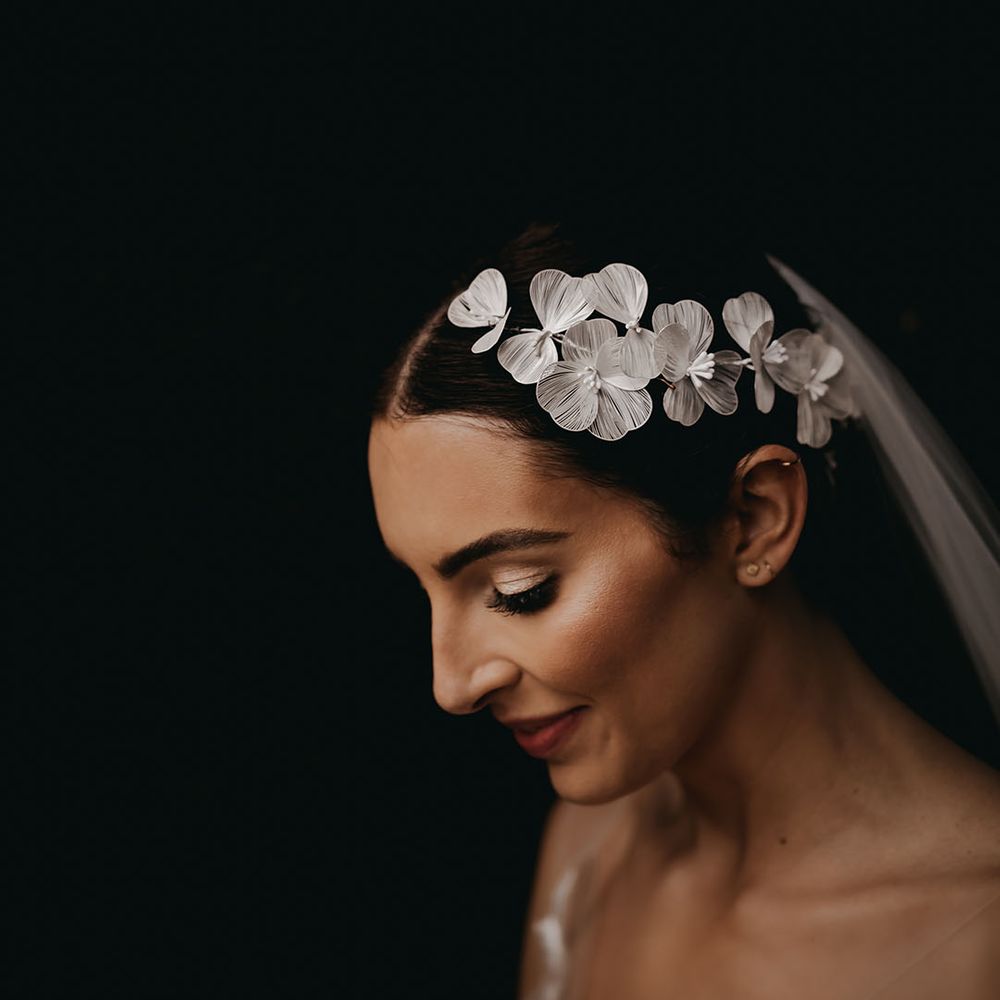 White flower bridal hairpiece from The Bobby Pin to match the flower wedding dress 
