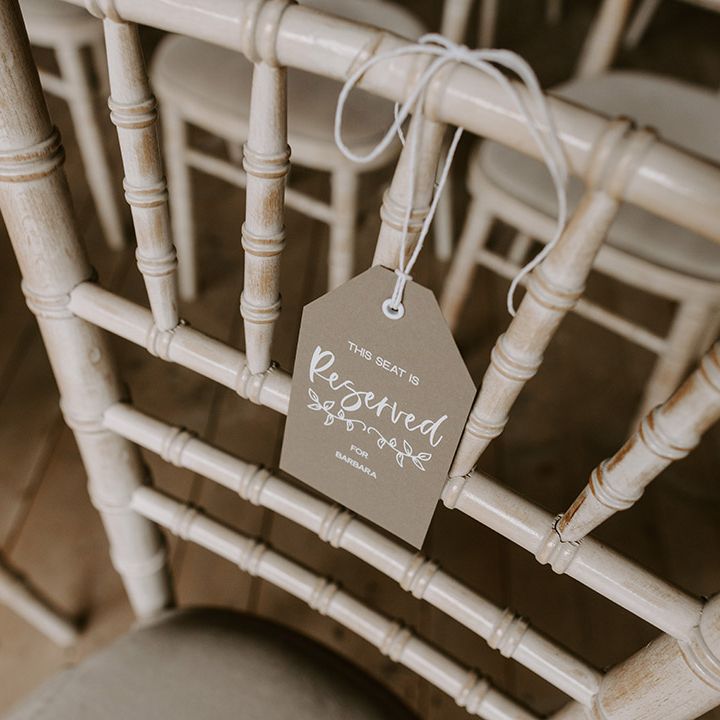 Grey reserved chair tag decor for the front row of seats for close family members or friends 