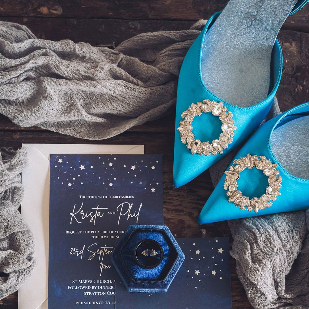 Dark blue wedding stationery with dark blue ring box with light blue pointed wedding shoes 