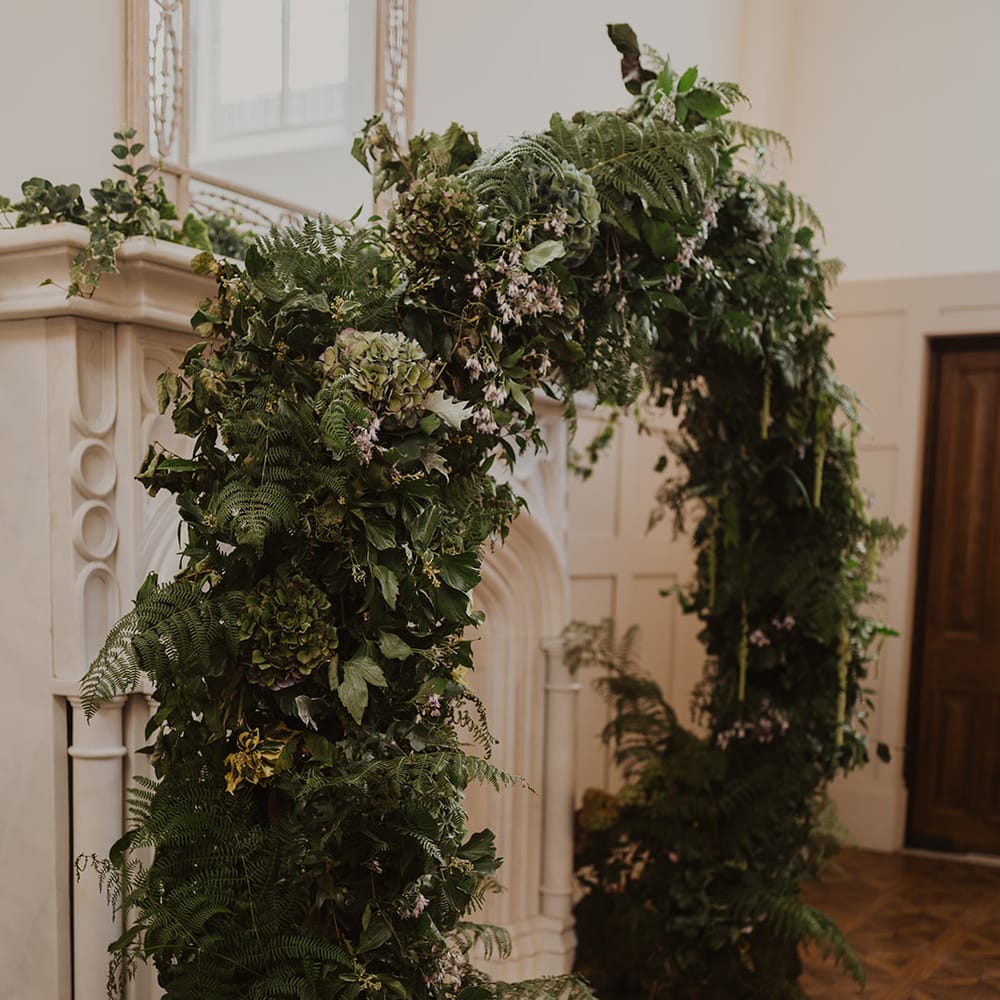 foliage and flower arch with hydrangeas and ferns