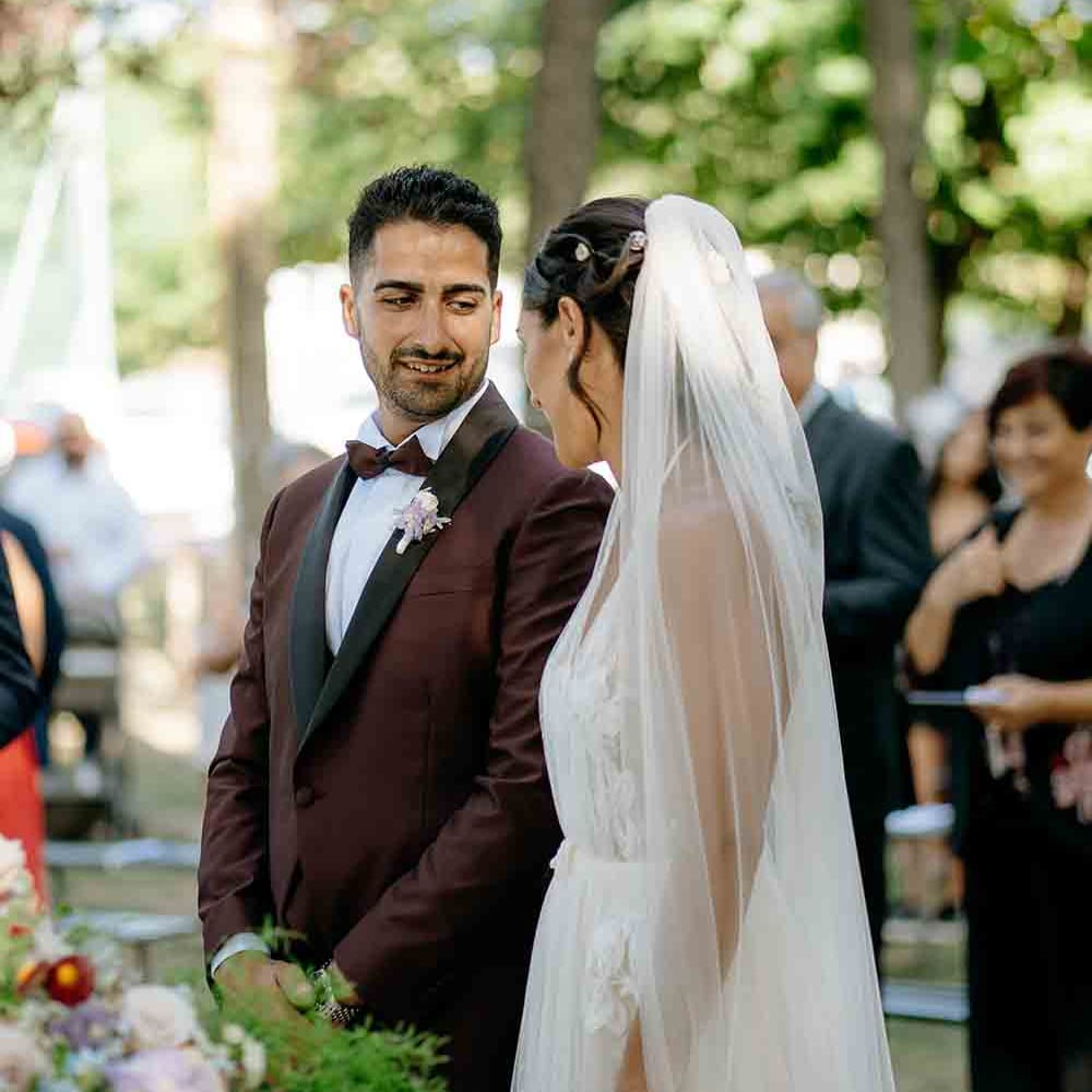 Bride and groom during outdoor wedding ceremony in Italy