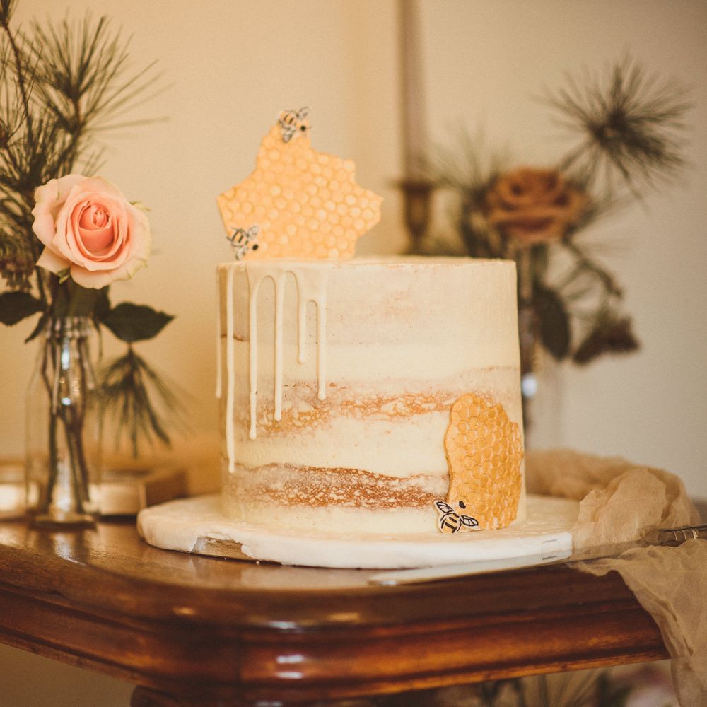 Single tier semi naked wedding cake with waffles and bee design 