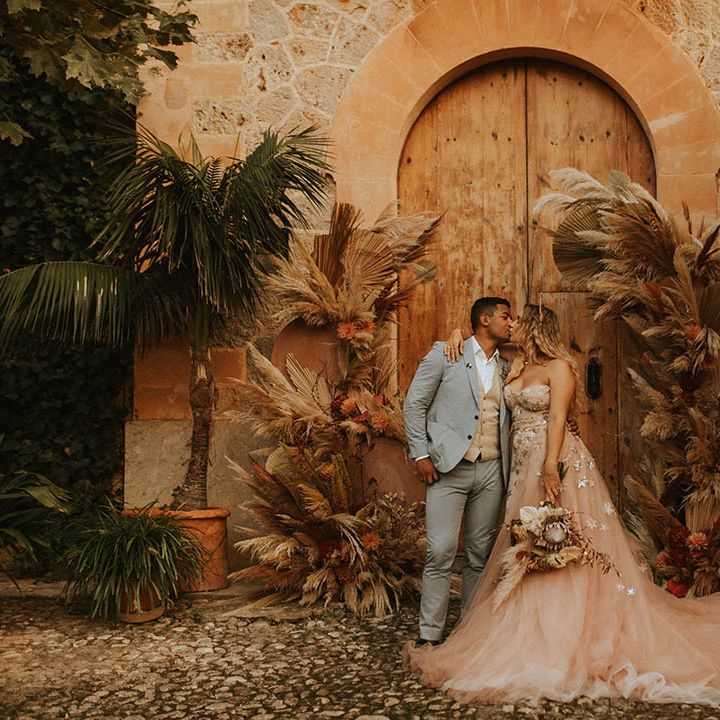 Bride leans in to groom on her wedding day