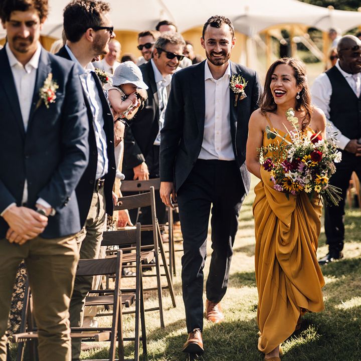 Bride & groom walk together on their wedding day