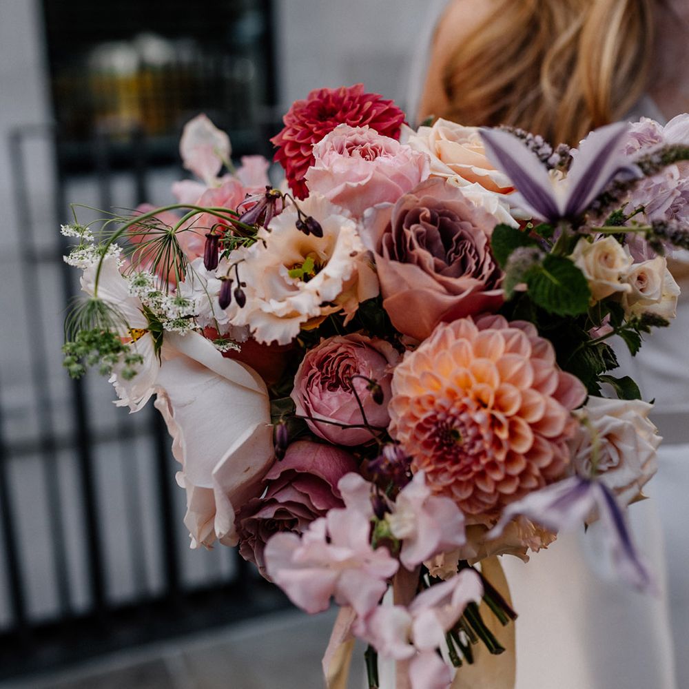 Blush pink wedding bouquet with roses and pom pom dahlias 