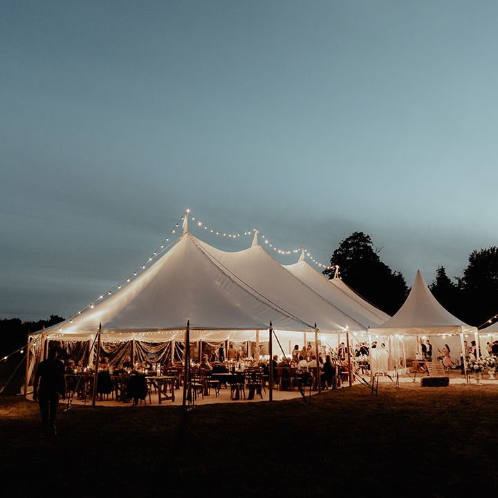 Lit up wedding marquee reception 