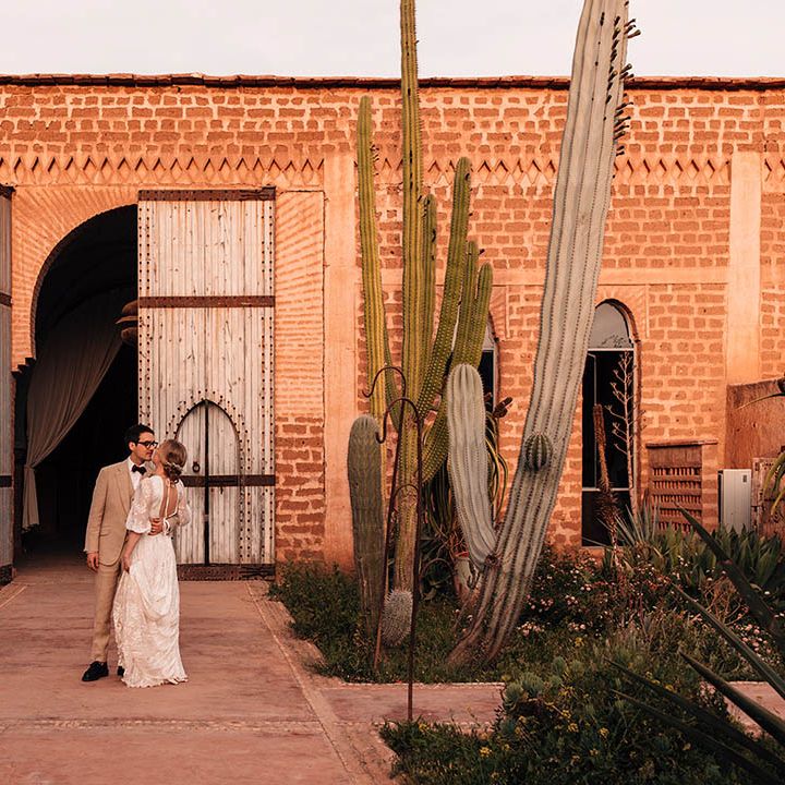 Beldi Country Club wedding venue with cacti with the bride and groom posing for their couple portraits 