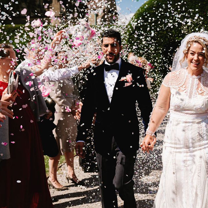 Confetti exit for the bride and groom as they exit from their luxury wedding ceremony 