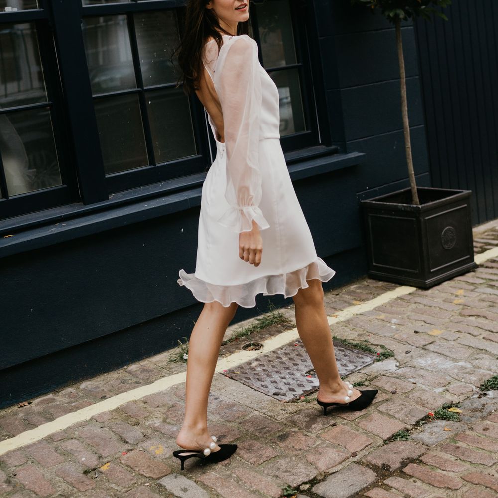 Bride in knee length wedding dress perfect for an intimate wedding