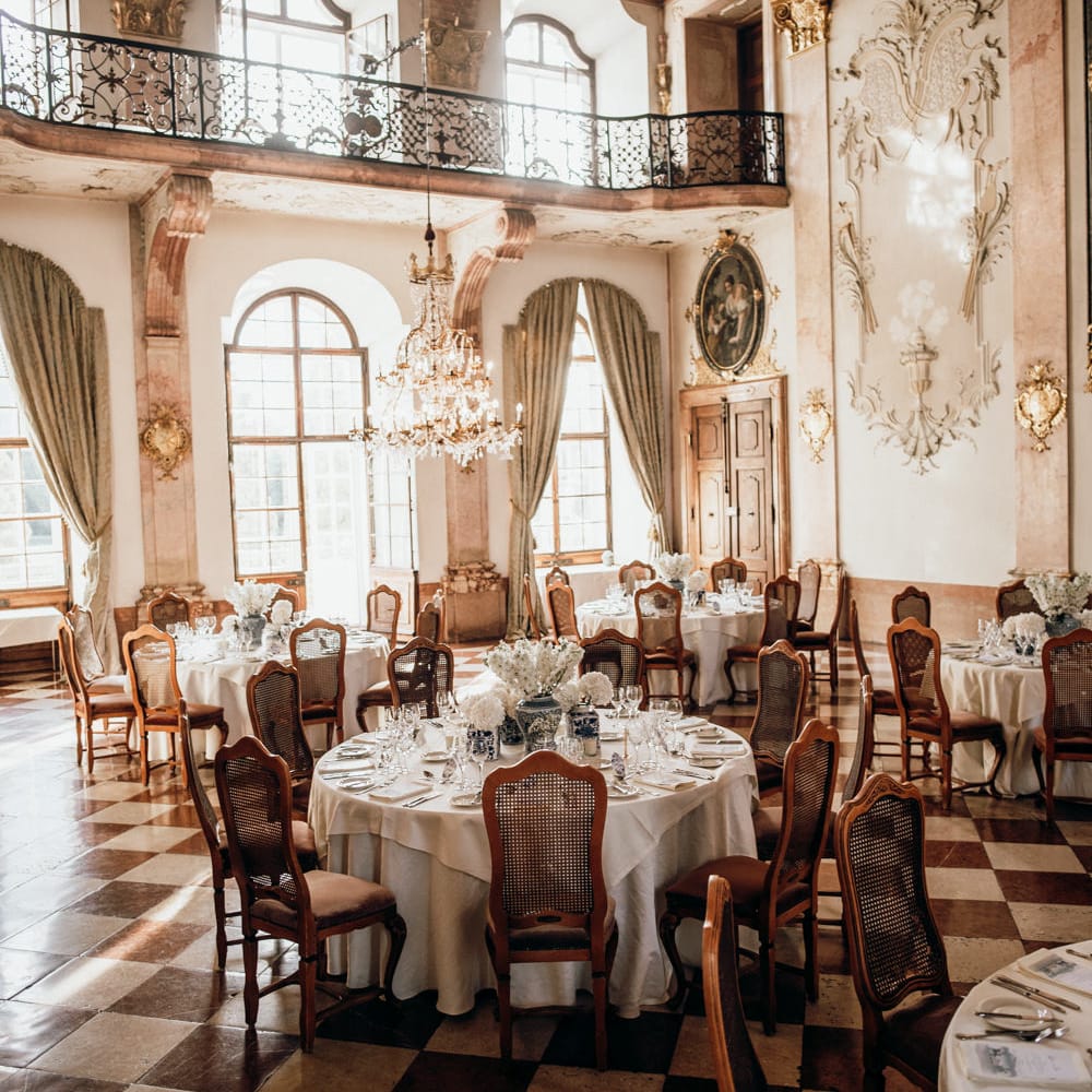 Intimate wedding reception with blue and white Chinese Pottery centrepieces 