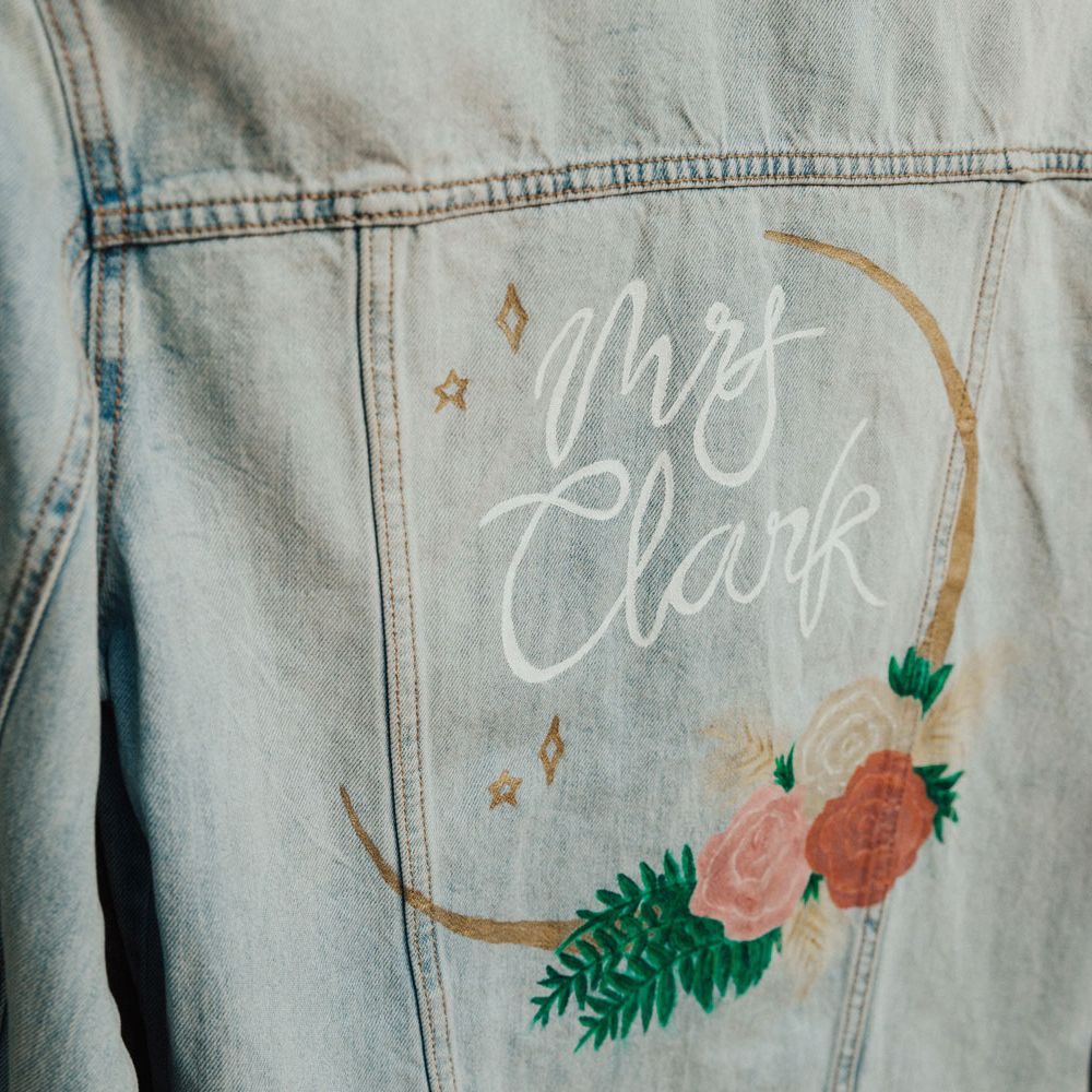Hand painted denim bridal jacket with rose and star details
