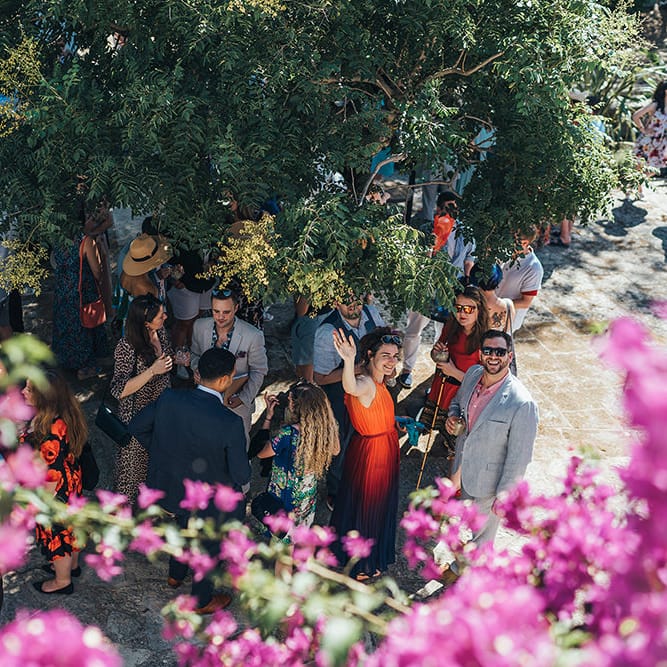 Wedding guests celebrate outdoors in Menorca