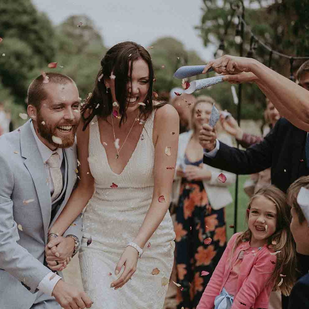 Confetti moment for bride and groom at Pylewell Park wedding