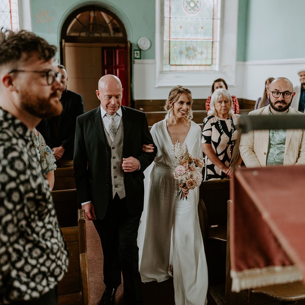 Bride walks down the aisle on her wedding day