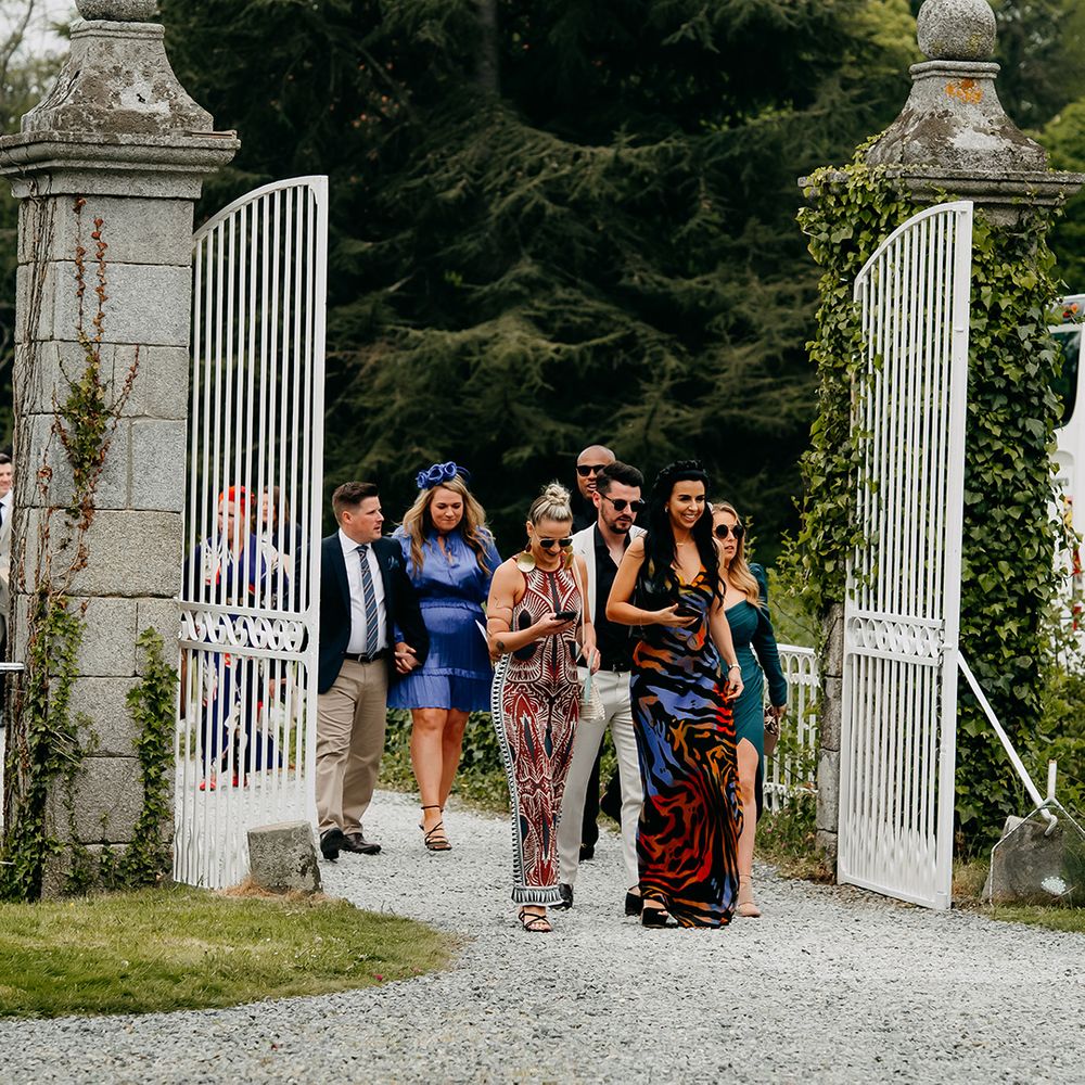 Wedding guests turn up to the chateau for the wedding 