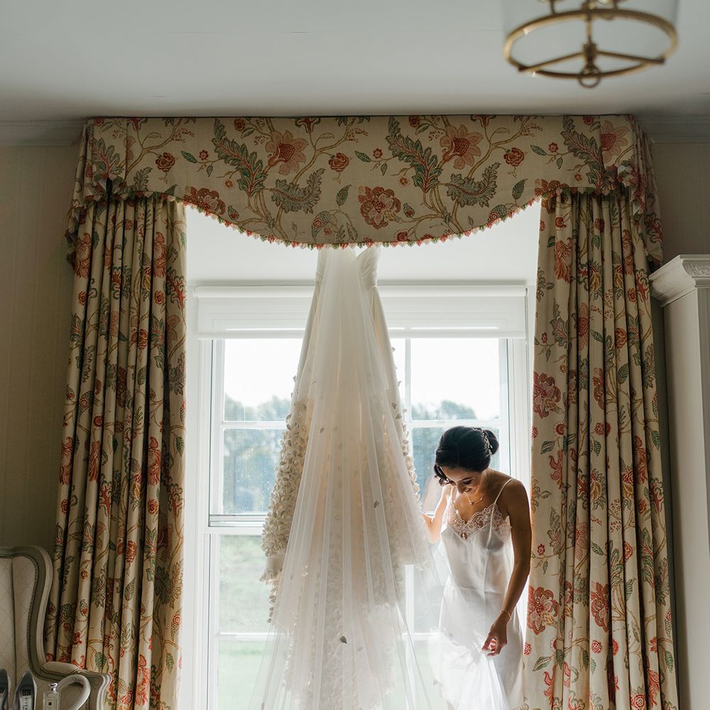 Emma Beaumont design wedding dress with floral embellished Princess skirt and cathedral styled veil 