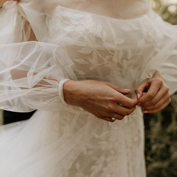 Bride in strapless Milla Nova wedding dress with tulle detachable sleeves for woodland Camp Katur wedding 