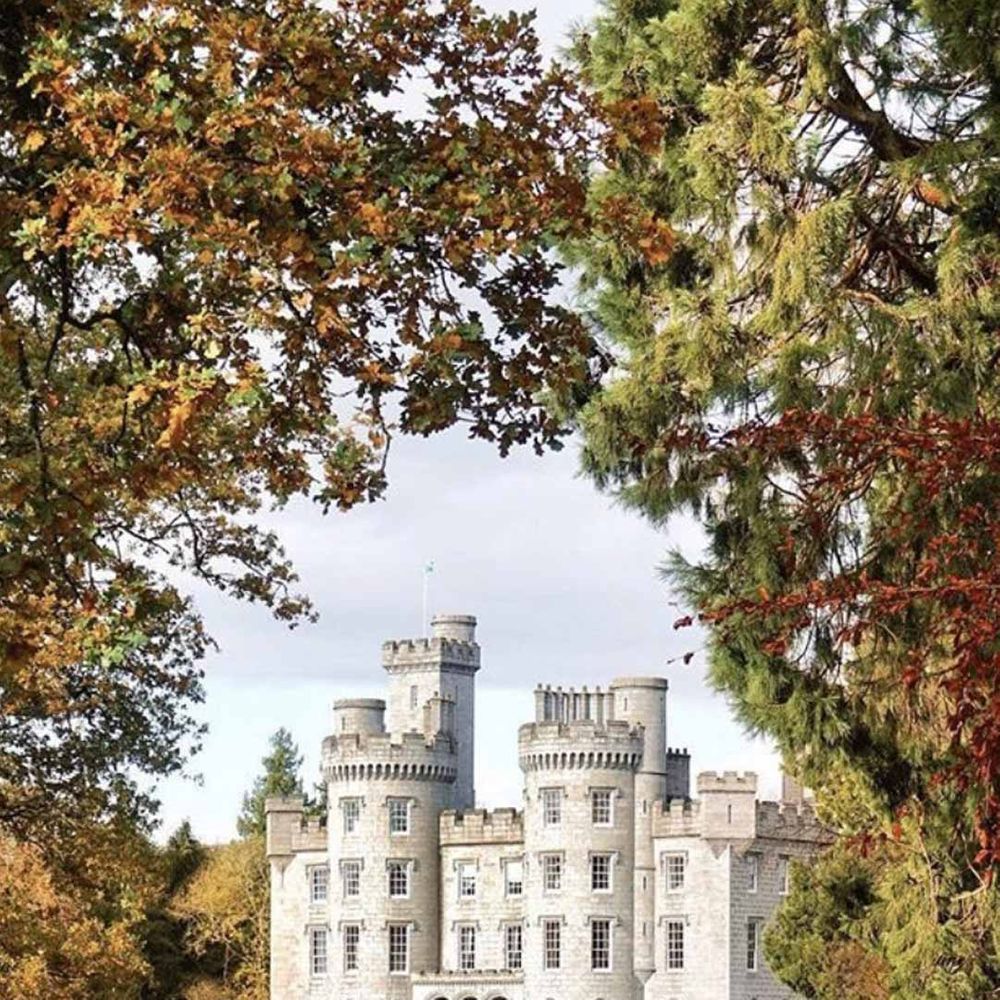 Exterior shot of manicured gardens of Cluny Castle wedding venue in Scotland 