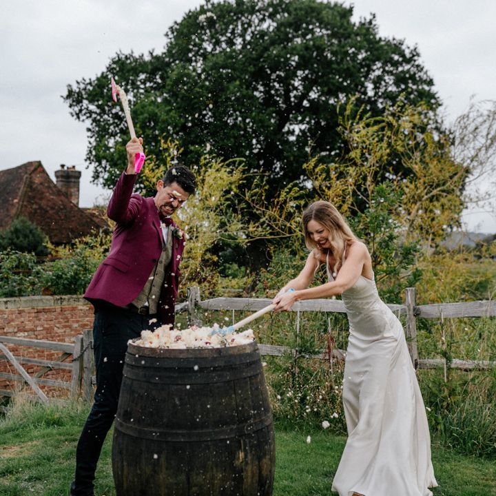 Bride and groom wedding cake smash