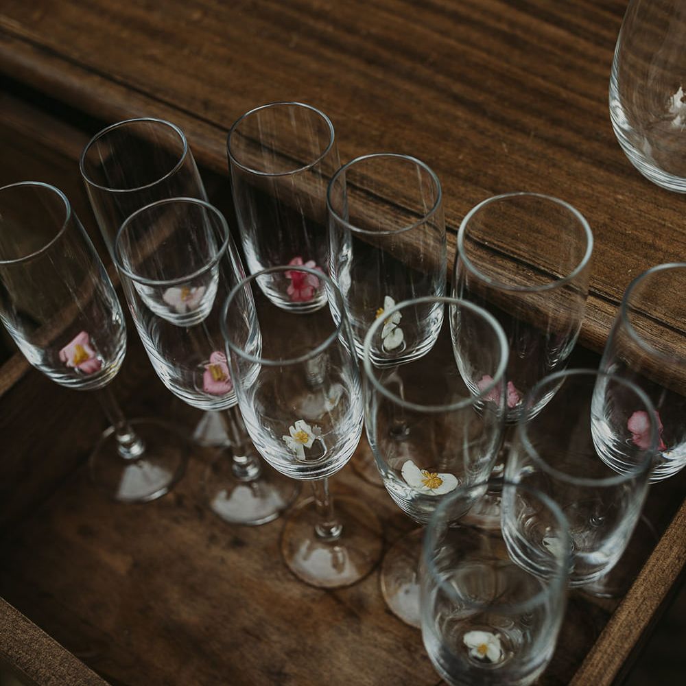 Champagne glasses decorated with edible flowers 