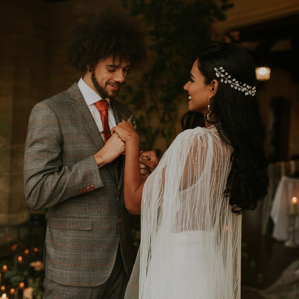 Bride wearing a hair vine and bridal cape 