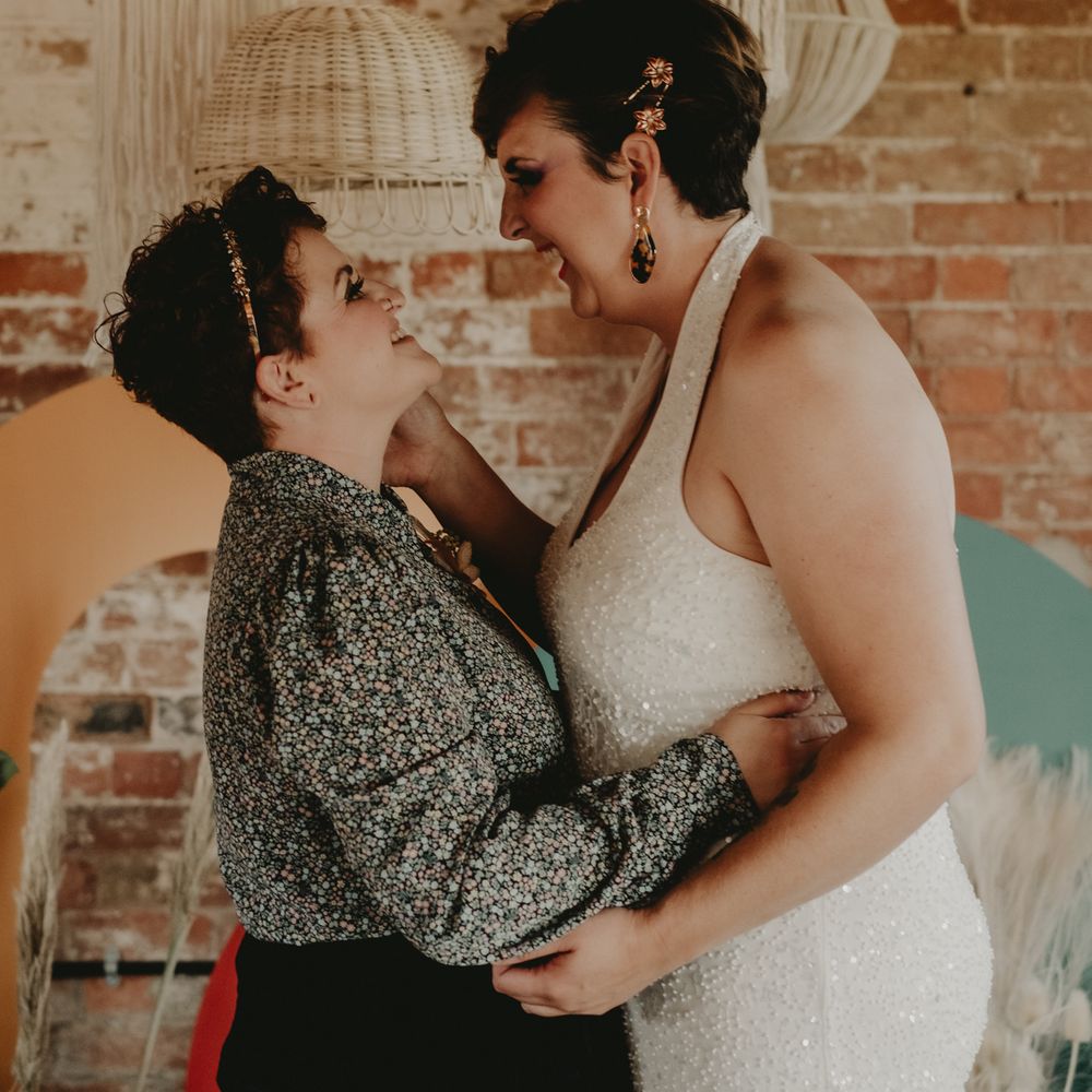 Intimate wedding portrait of two brides at LGBT wedding 
