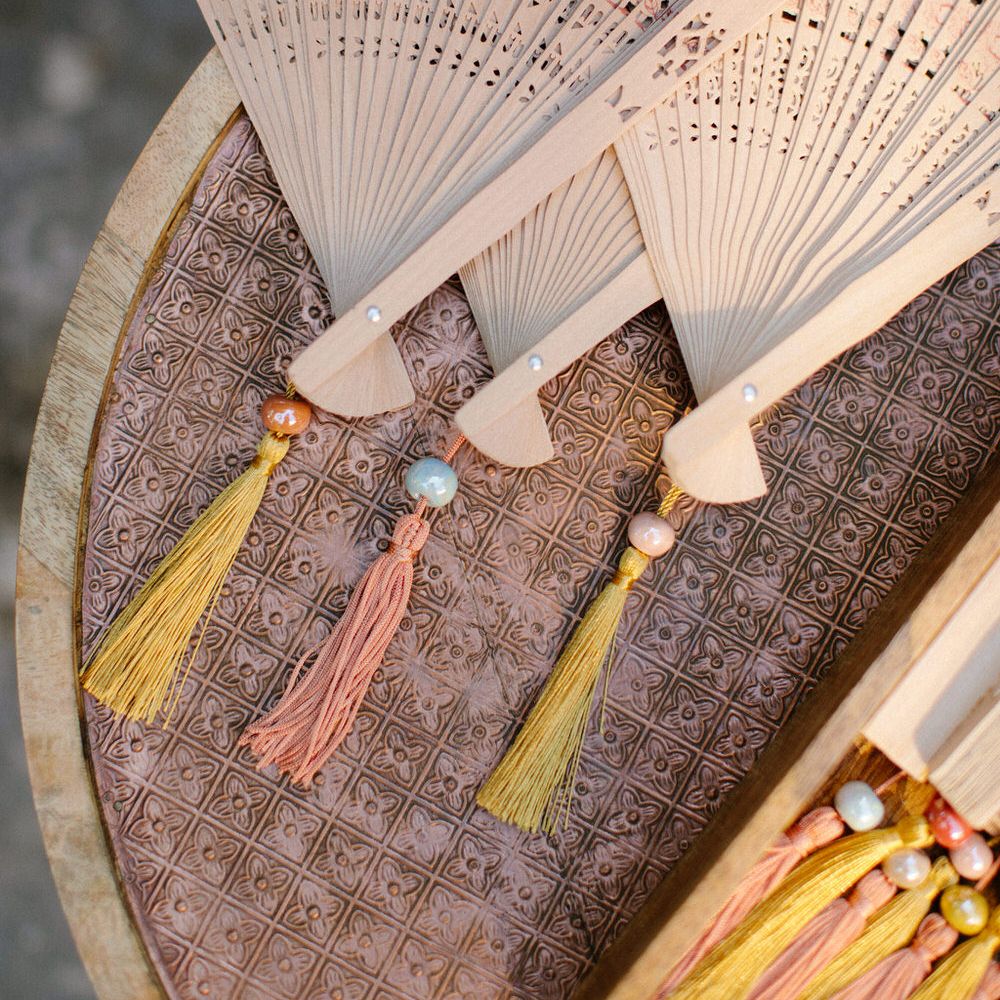 Wooden fans for guests to help themselves to