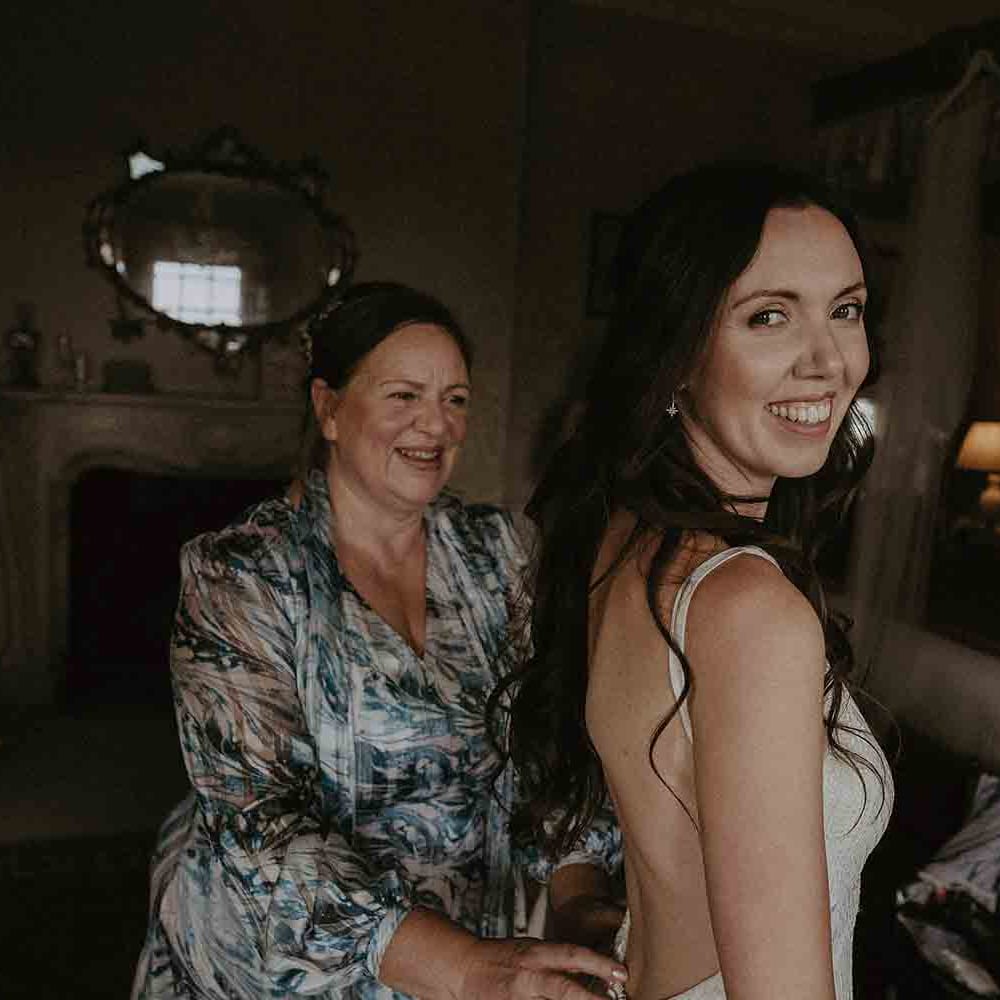 Beautiful bride smiles during preparations 