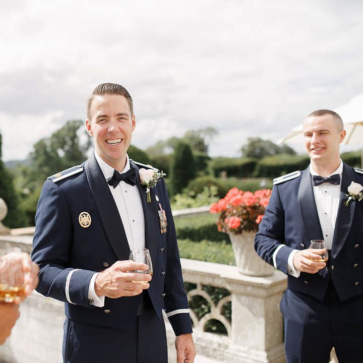 Groom wears Military Uniform and floral buttonhole on wedding day