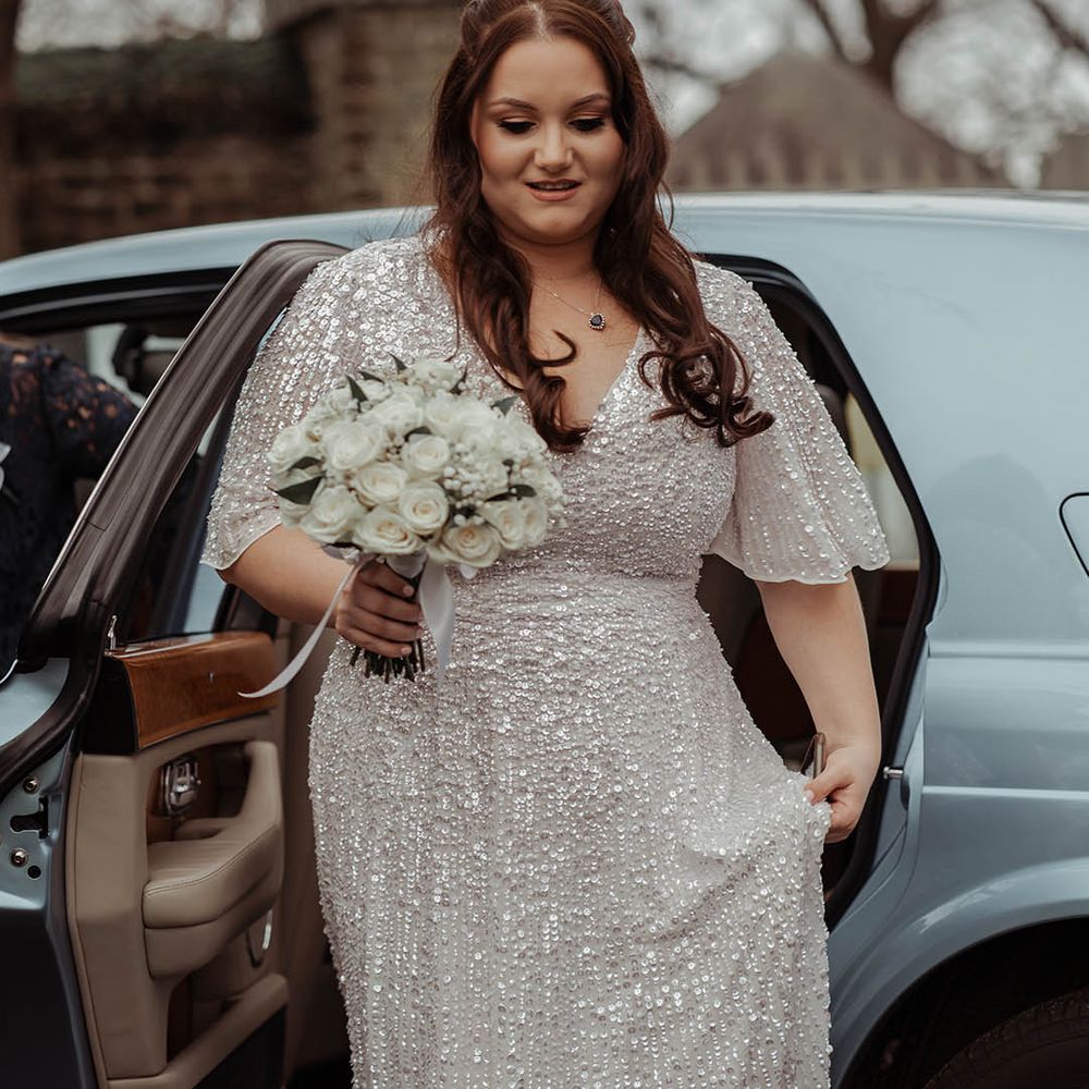 Bride leaves car wearing glittery ASOS wedding gown