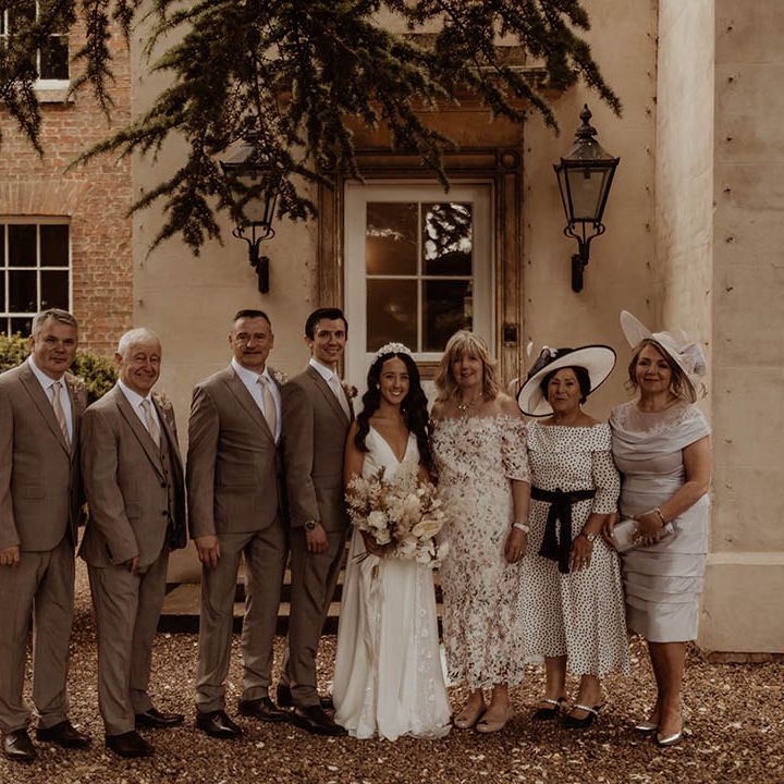 Bride and groom with members of the wedding party wedding guest fashion 