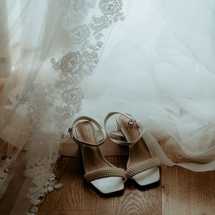 Square toe pearl strap white wedding shoes from Quiz worn by the bride 