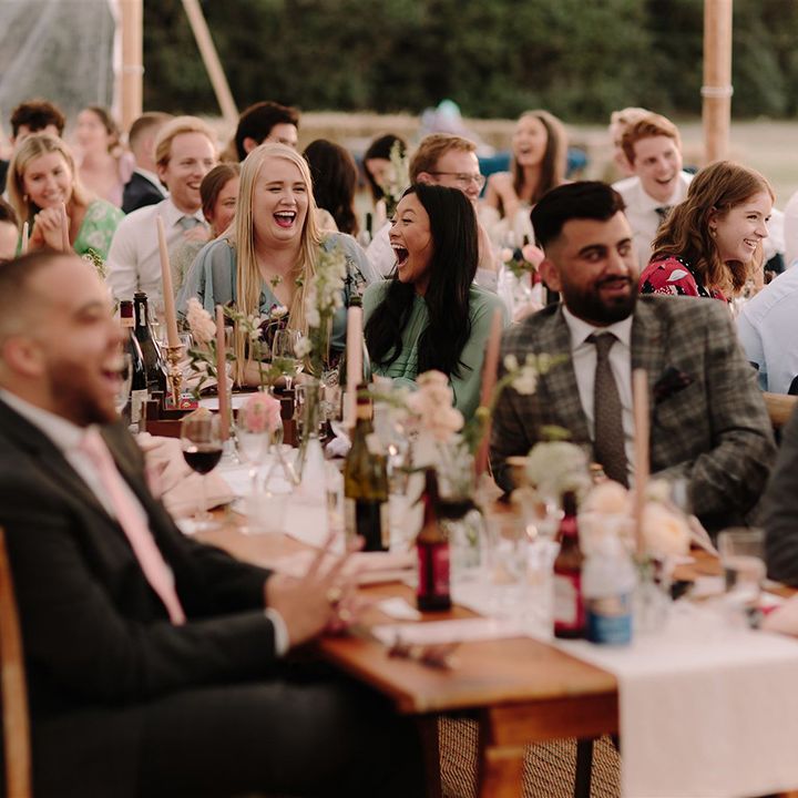 Wedding guests enjoy wedding speeches at White Pond Farm venue