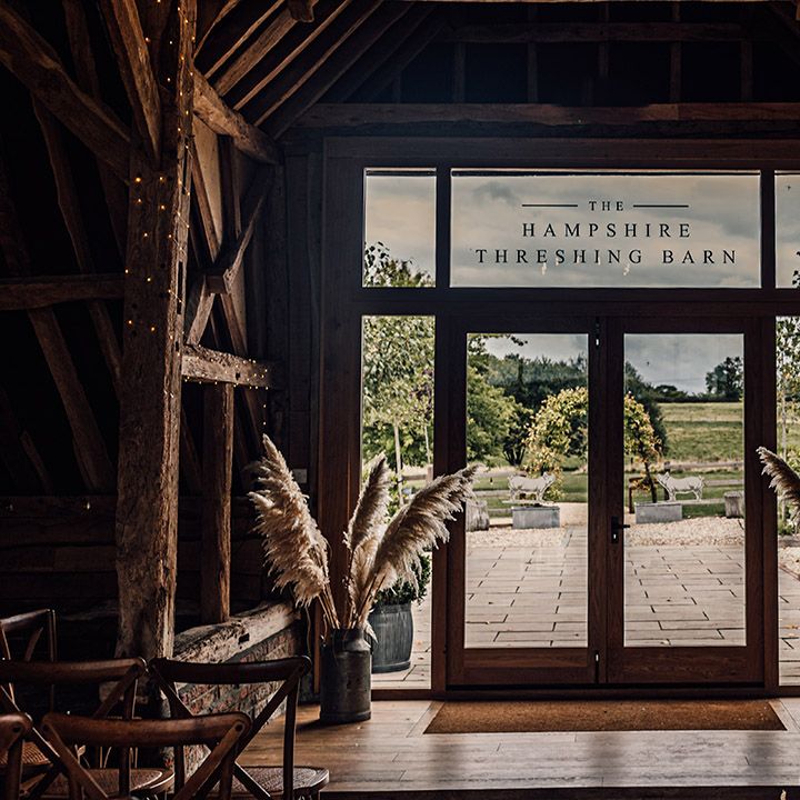 Threshing Barn at Silchester Farm wedding venue with pampas grass flower decorations