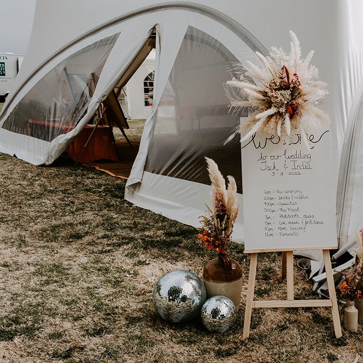 Welcome wedding sign on wooden easel complete with dried floral arrangements 