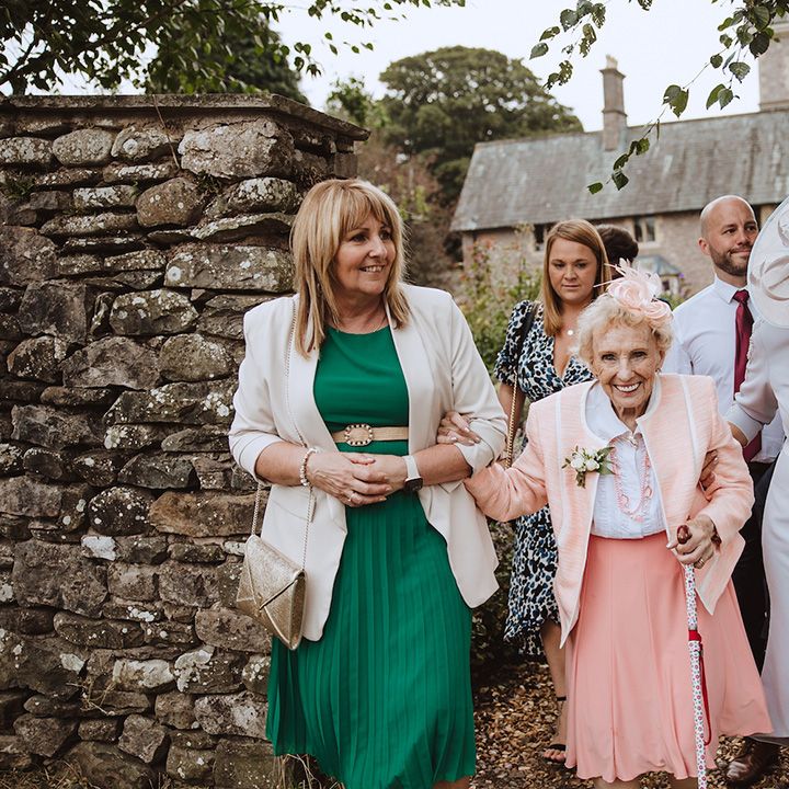 Wedding guests in pastel wedding outfits for the blush pink wedding at The Casterton Grange Estate 