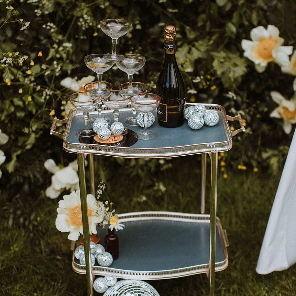 gold hostess trolley with a coupe champagne tower 