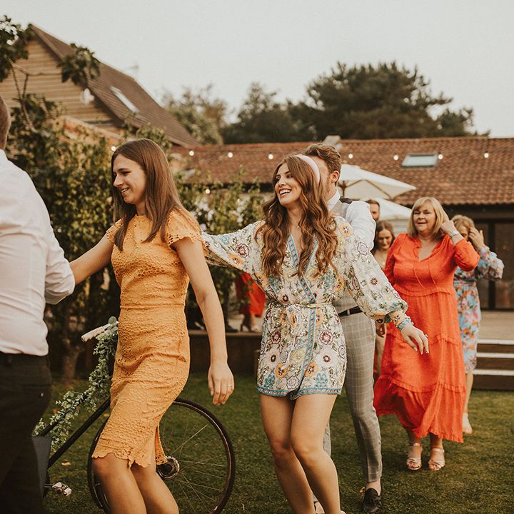 Wedding guests do the conga around East Afton Farmhouse venue