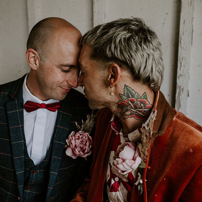 Grooms wear homemade floral buttonholes on their wedding day