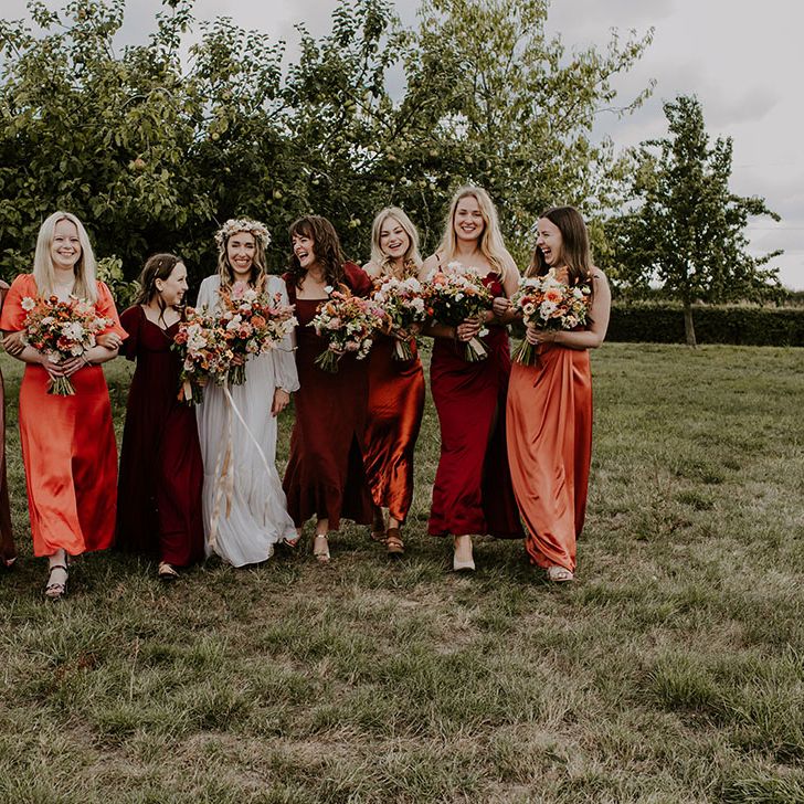 Bridesmaids wear Autumnal colour bridesmaid dresses in mismatched styles