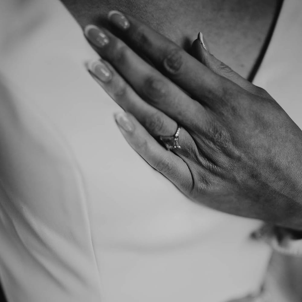 Marquise style very unique engagement ring worn by the bride 