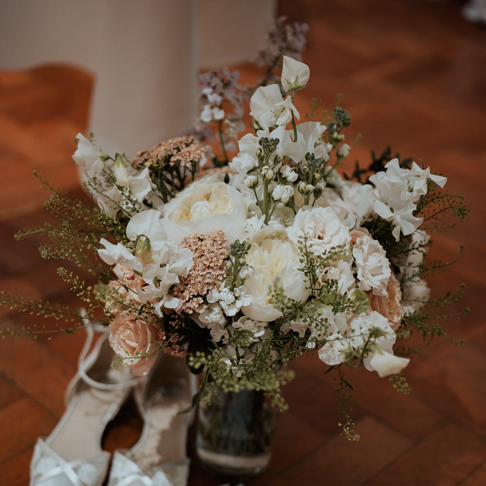 Pale pink and white wedding bouquet for the bride and classic country house wedding 