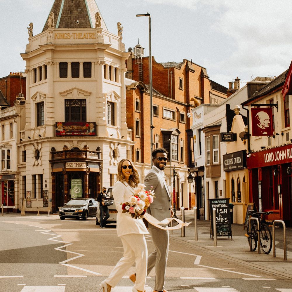 Bride and groom crossing the street in Portsmouth 